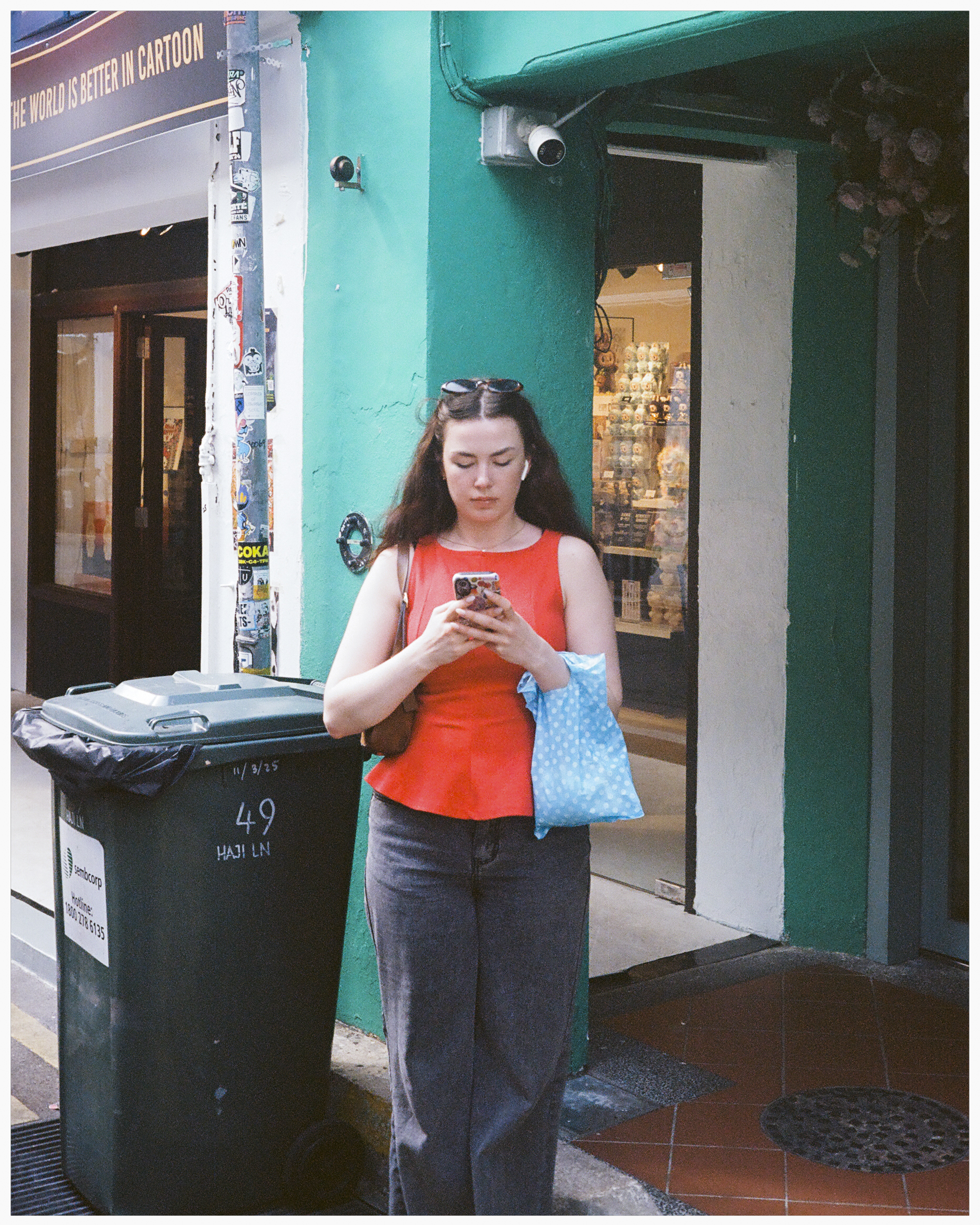 People — a person waiting alone at a bus stop